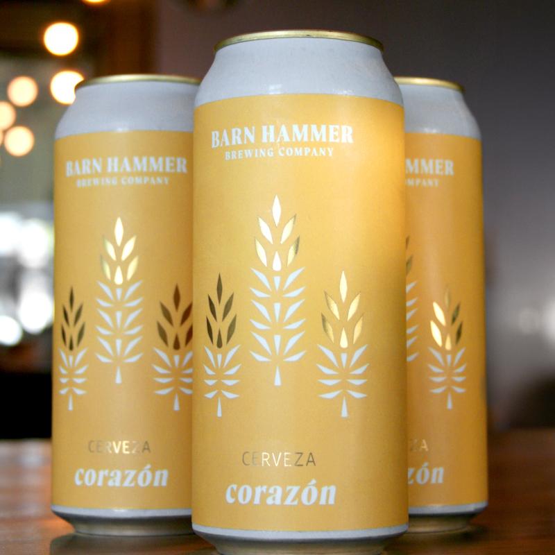 three cans cerveza on bartop
